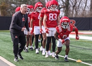 Rutgers wide receivers coach Dave Brock (left) offers words of encouragement toward DT Sheffield (0) during spring practice, Friday, March 28, 2025 in Piscataway, N.J.