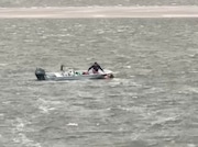 Cellphone footage of Brennan Bollard, owner of Sea Isle Parasail, in Seal Isle City, N.J., rescuing a kayaker and her two dogs from a stormy Townsends Inlet in Sea Isle City on June 19, 2025.