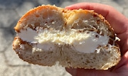 A sesame bagel with cream cheese from Apollo Bagels in Manhattan.