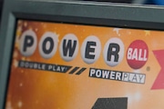 A display panel advertises tickets for a Powerball drawing at a convenience store, Nov. 7, 2022, in Renfrew, Pa. An estimated $1.04 billion Powerball jackpot will be up for grabs, tempting players to spend a couple dollars on a longshot chance at instant riches. The prize is the world’s ninth-largest lottery prize behind earlier drawings of Powerball and Mega Millions, the other nearly nationwide lottery game. The prize on the line Monday, Oct. 2, 2023 has grown so massive because there have been 32 consecutive drawings since someone won the jackpot. (AP Photo/Keith Srakocic, File)