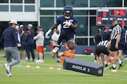 Chicago Bears running back Kyle Monangai runs a drill during NFL football practice at Halas Hall in Lake Forest, Ill., Tuesday, June 3, 2025. (AP Photo/Nam Y. Huh)