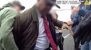 Newark Mayor Ras Baraka, who is running for governor of New Jersey, was detained and then released Friday night after being arrested at a immigration detention facility in the city. Pictured: A still from body camera footage at the scene.