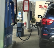 An SUV fuels up at an Exxon Station at the Colonia Service Area on the Garden State Parkway. Gas prices increased a dime a gallon in New Jersey, but experts say don't panic.