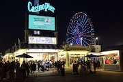 A ferris wheel lights up the boardwalk in Seaside Heights on Thursday, June 29, 2023.