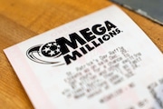 A Mega Millions lottery ticket is displayed at a store on Thursday, Dec. 26, 2024, in Tigard, Ore. A $1.22 billion jackpot-winning ticket was sold in California for the drawing on Friday, Dec. 27, 2024.