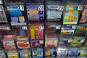 Some of the scratch off tickets being sold. Lottery tickets may soon be available on line and that has convenience store owners like Jignesh Patel, who owns a Krauszer's store in South Amboy, nervous on Tuesday, June 14, 2011. Ed Murray/The Star-Ledger TO PURCHASE THIS PHOTO, CALL THE STAR-LEDGER PHOTO LIBRARY AT 973-392-1530 SL