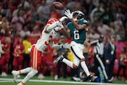Philadelphia Eagles wide receiver DeVonta Smith (6) makes a touchdown past Kansas City Chiefs cornerback Jaylen Watson (35) during the second half of the NFL Super Bowl 59 football game, Sunday, Feb. 9, 2025, in New Orleans. (AP Photo/Matt Slocum)