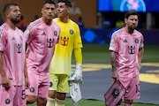 Inter Miami's Lionel Messi (10) stands on the field with his teammates during the Club World Cup group A soccer match between Inter Miami and FC Porto, Friday, June 20, 2025, in Atlanta. (AP Photo/Mike Stewart)