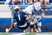 Cooper Richman (20) of Westfield battles with Teddy Coyle (1) of Seton Hall Prep on the face off during the boys lacrosse Kirst Cup Final at Kean University in Union, NJ on Thursday, June 19, 2025.